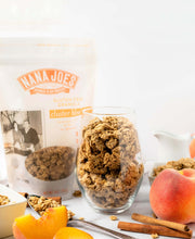 Load image into Gallery viewer, Nana Joes Granola Organic Cluster Peach and Cashew Butter blend in a cup with peaches
