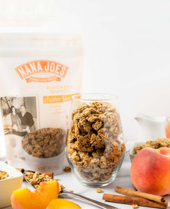 Nana Joes Granola Organic Cluster Peach and Cashew Butter blend in a cup with peaches