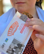 Load image into Gallery viewer, Girl eats a Ocean Beach Granola Bar 
