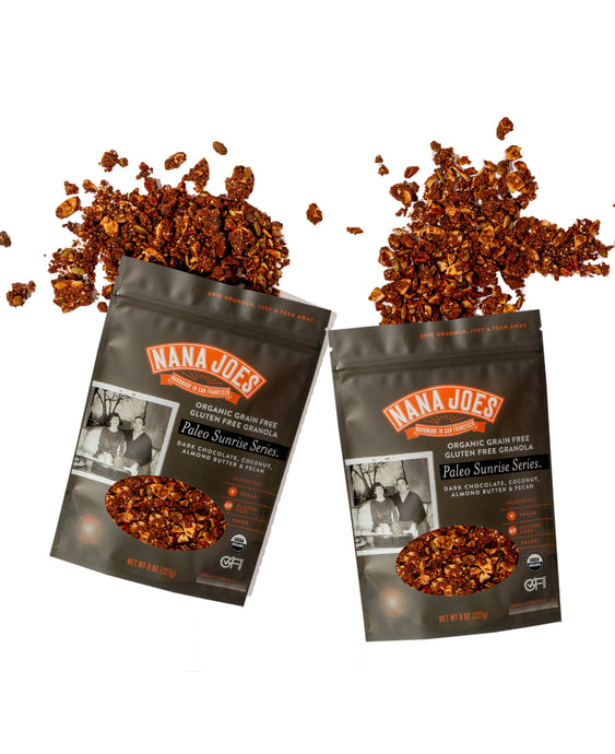 Two open bags of Nana Joe's Paleo Series granola with spilled contents on a white background.